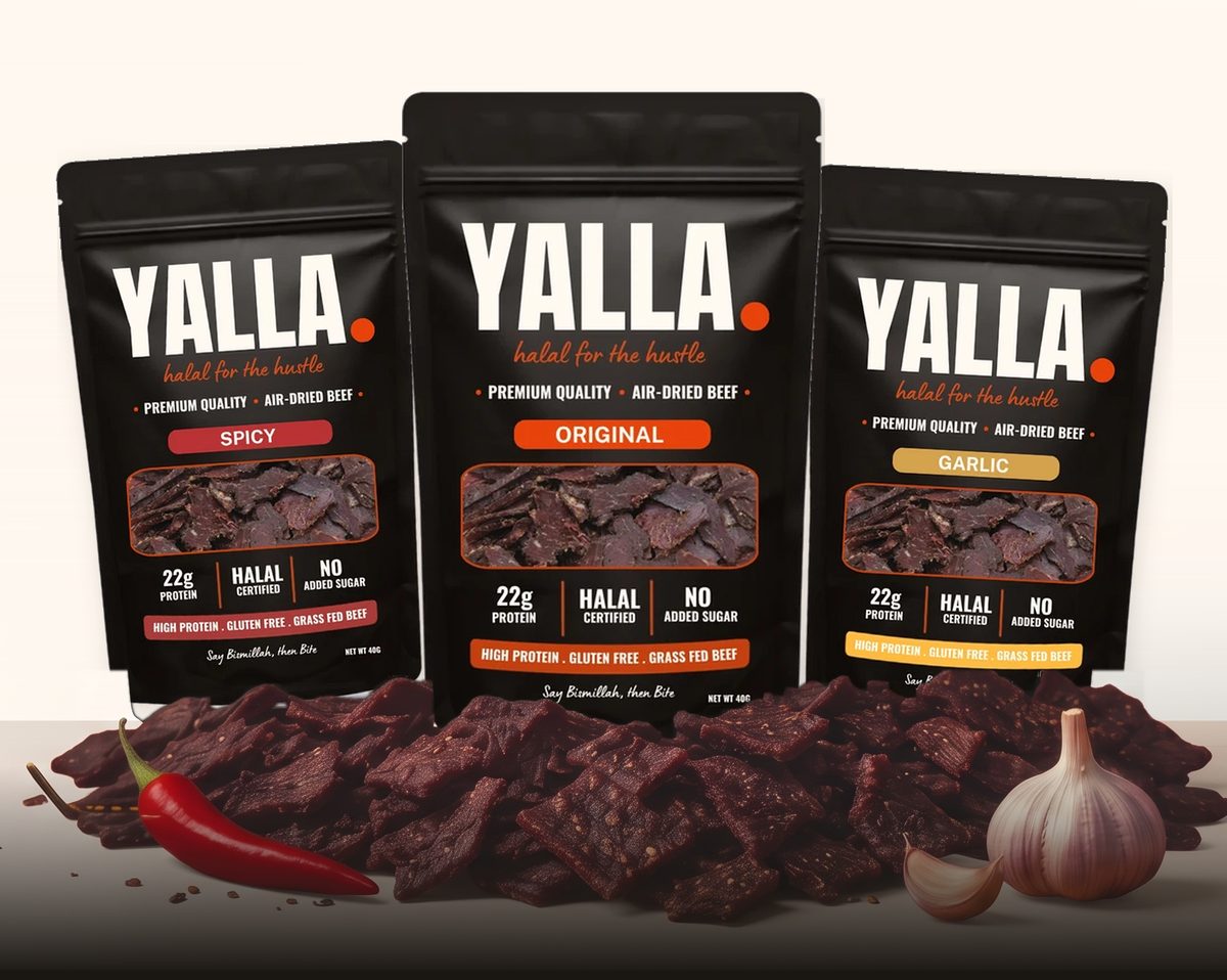YALLA Spicy, Original and Garlic bags behind a pile of air-dried beef, with a chilli and garlic